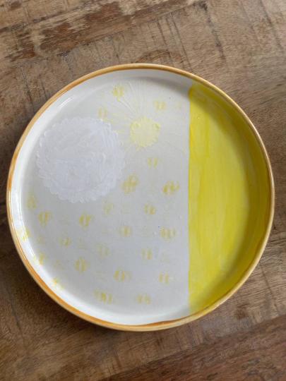 Bord met zon en bijtjes
