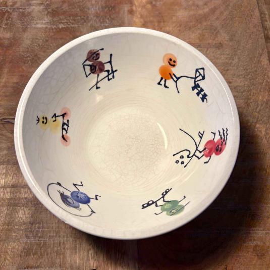 Kom met sportieve figuurtjes